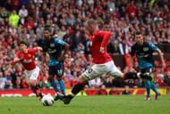 MANCHESTER, ENGLAND - AUGUST 28:  Wayne Rooney of Manchester United scores his third goal from the penalty spot during the Barclays Premier League match between Manchester United and Arsenal at Old Trafford on August 28, 2011 in Manchester, England.  (Photo by Alex Livesey/Getty Images)